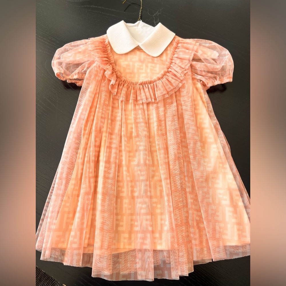 Light Pink/peachy color Fendi Dress chiffon overlay
Sized for a 3T girl